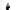 Black and white image of Mariza standing in front of a white backdrop and covering one eye.