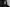 Greyscale portrait of Lucy Railton who has long hair looking directly at the camera
