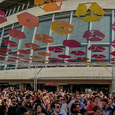 Crowd on the Riverside Terrace under a colourful canopy