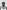 Black and white head shot of Sauti Choir member J Cocoa, posing against the wall of the Royal Festival Hall.