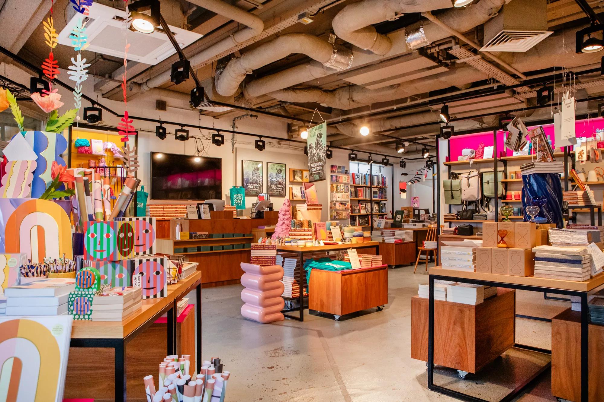 Photo of four tables with colourful stock, posters, catalogues and decorations for When Forms Come Alive