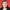 The MP Emma Dent Coad faces the camera in front of a red background