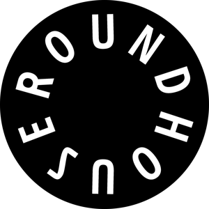 Black circular roundhouse logo with white text