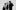 Three musicians stnading at different angles
