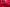 A group of people in a red installation made of second hand clothing