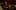 Singer Kathy Sledge, a Black woman with long brown hair, sits smiling in the auditorium seats of the Royal Festival Hall