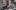 Angelique Kidjo sings in front of an overhead image of an African city