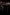 A blurry image of a group of dancers all wearing black