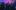 Ezra Collective, Kinetika Bloco and Jorja Smith on stage at the 2025 Brit Awards. Confetti is raining down and the young members of Kinetika Bloco are holding their musical instruments in the air.
