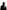 GAIKA stands in front of a light background, he wears a black leather jacket and sunglasses