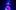 A performer elevated from the ground on stage under a blue spotlight with her voluminous dress spread outwards.
