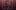 A moment within Circa\'s Duck Pond; a performer in white wearing a large ruff is thrown in the air by another performer all in black wearing a crown. Three other performers in all black wait to catch the airborne performer.