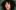 Anna Seymour, a white woman with dark curly hair