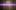A fuzzy image of a rectangular object cut horizontally by a bright purple beam, with vertical lines and dark spots.